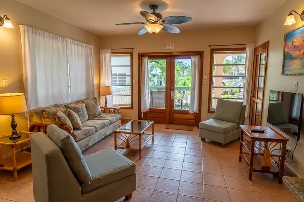 a living room with furniture and a flat screen tv