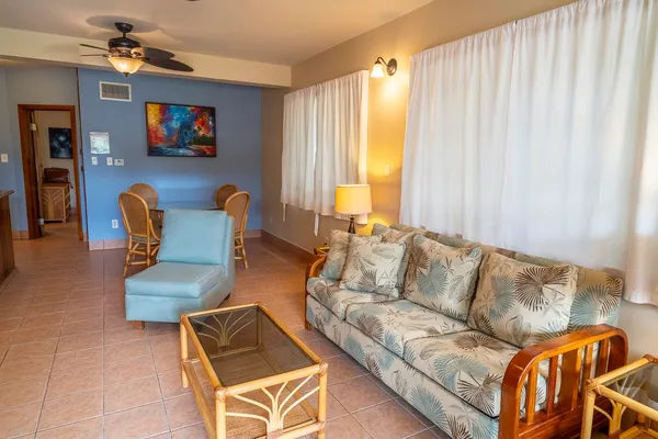 a living room with furniture and a flat screen tv