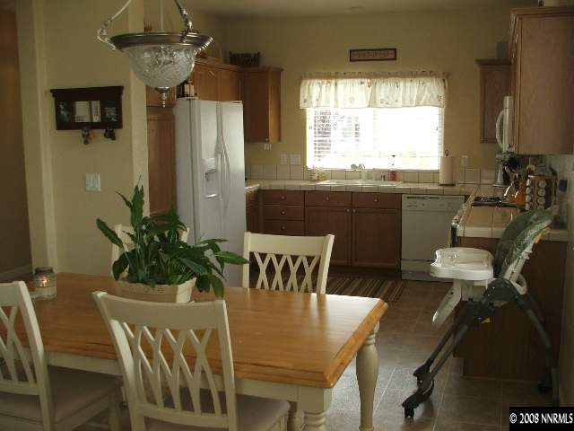 1773 River Gorge Drive Reno, NV 89521 - Photo 3 of 8 a view of a dining room with furniture window and outside view