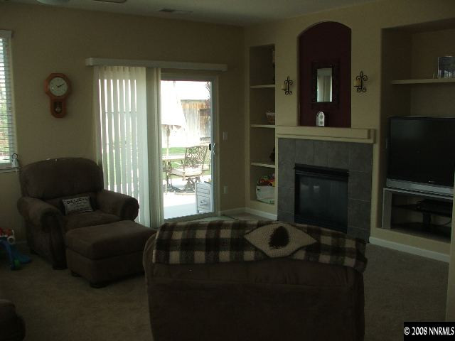 1773 River Gorge Drive Reno, NV 89521 - Photo 4 of 8 a living room with furniture and a fireplace