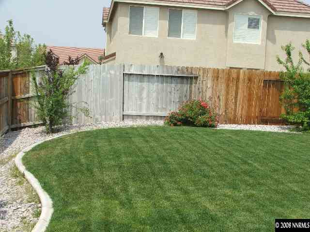 1773 River Gorge Drive Reno, NV 89521 - Photo 6 of 8 a view of a backyard with potted plants