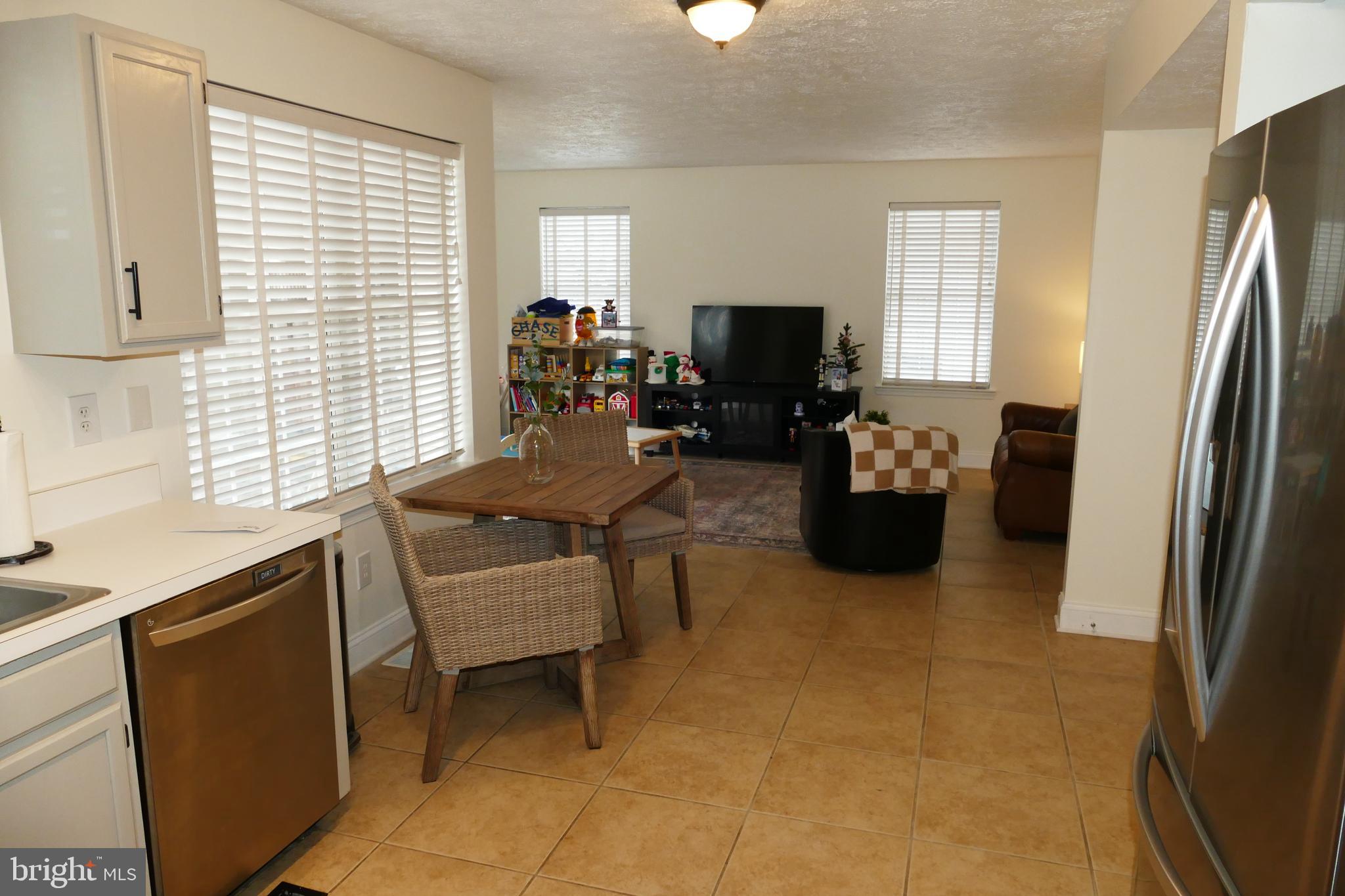 7816 Mallow Court Pasadena, MD 21122 - Photo 5 of 24 Dinette area leading into Family Room