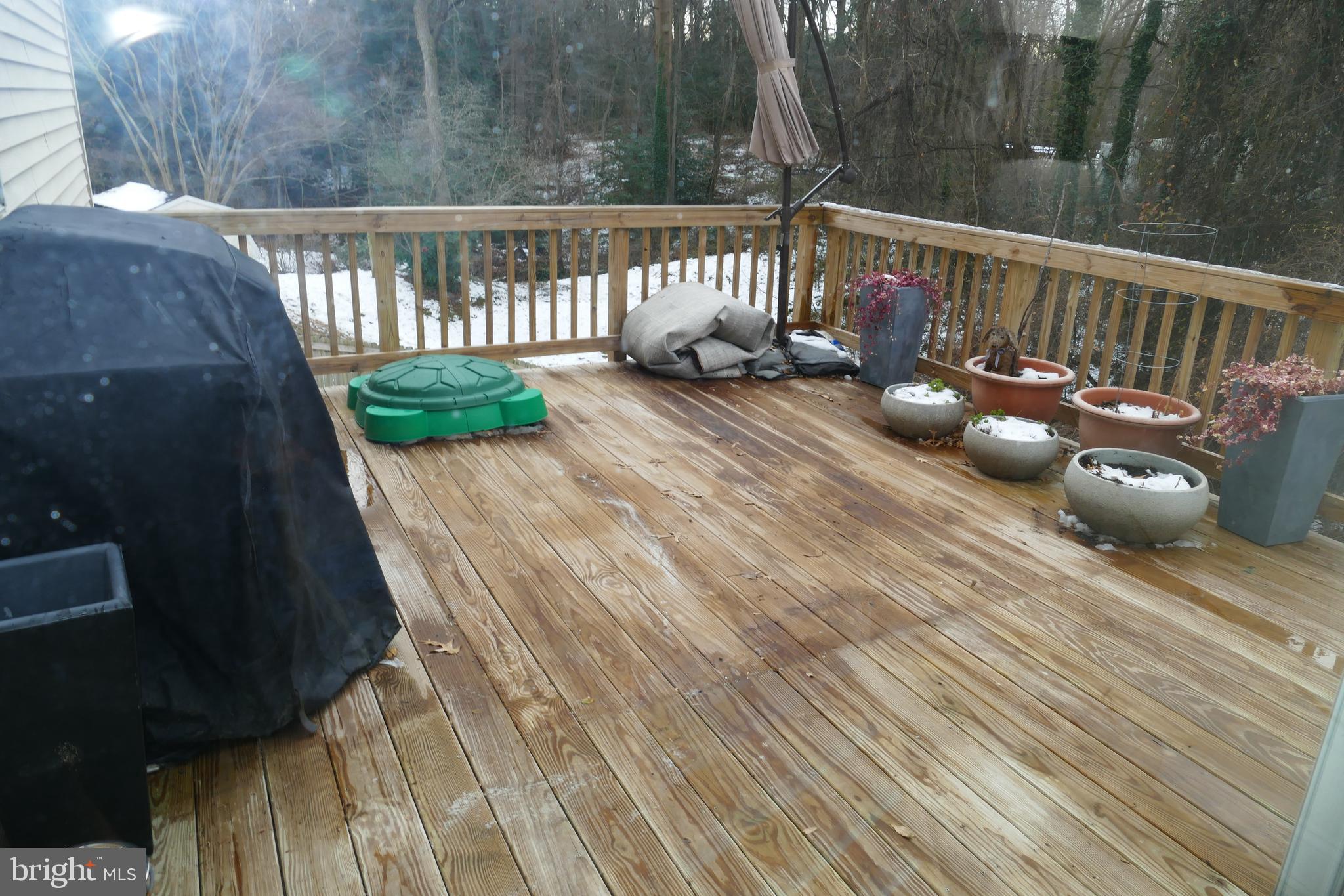 7816 Mallow Court Pasadena, MD 21122 - Photo 9 of 24 Deck with stairs to back yard