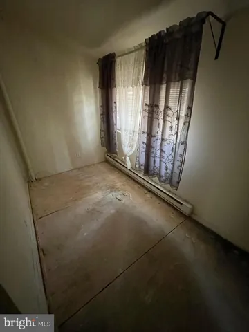 a view of an empty room with windows