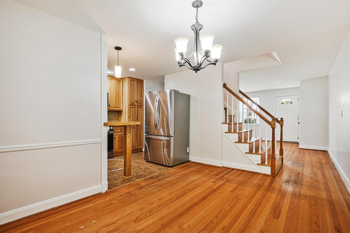 1016 Winsford Road Towson, MD 21204 - Photo 10 of 42 a view of a room with wooden floor and staircase