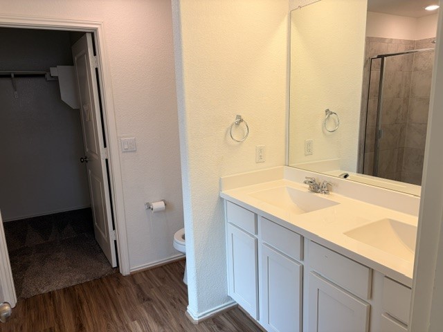6917 Colorado Bluffs Road Austin, TX 78744 - Photo 7 of 19 a bathroom with a sink and a mirror