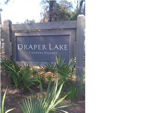9-1 Draper Lake Santa Rosa Beach, FL 32459 - Photo 1 of 4 a sign that is sitting in front of a building