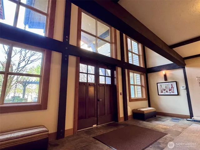 a living room with furniture and windows