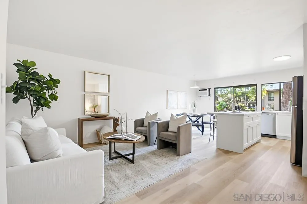 7858 Cowles Mountain Court, Unit D7 San Diego, CA 92119 - Photo 1 of 40 a living room with furniture and a potted plant