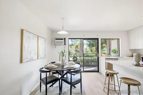 a view of a dining room with furniture window and outside view