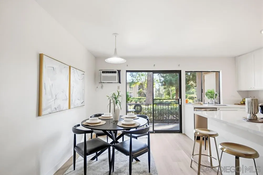 7858 Cowles Mountain Court, Unit D7 San Diego, CA 92119 - Photo 19 of 40 a view of a dining room with furniture window and outside view