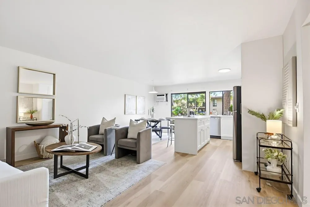 7858 Cowles Mountain Court, Unit D7 San Diego, CA 92119 - Photo 2 of 40 a living room with furniture and a large window