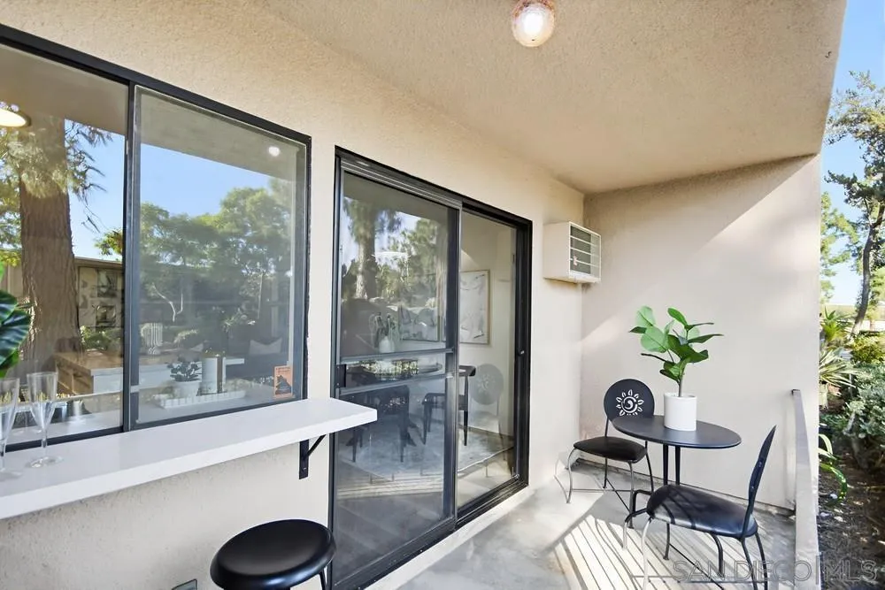7858 Cowles Mountain Court, Unit D7 San Diego, CA 92119 - Photo 29 of 40 a living room with furniture and a potted plant