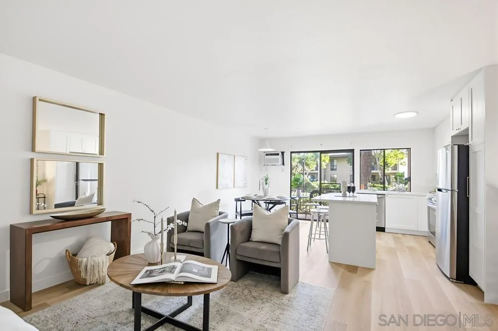 7858 Cowles Mountain Court, Unit D7 San Diego, CA 92119 - Photo 3 of 40 a living room with furniture a large window and wooden floor