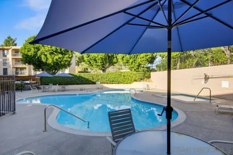 a view of a backyard with sitting area