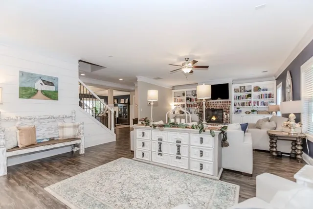a view of a dining room with furniture wooden floor and chandelier