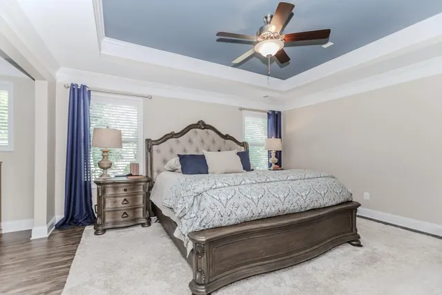 a spacious bathroom with a granite countertop sink and a mirror