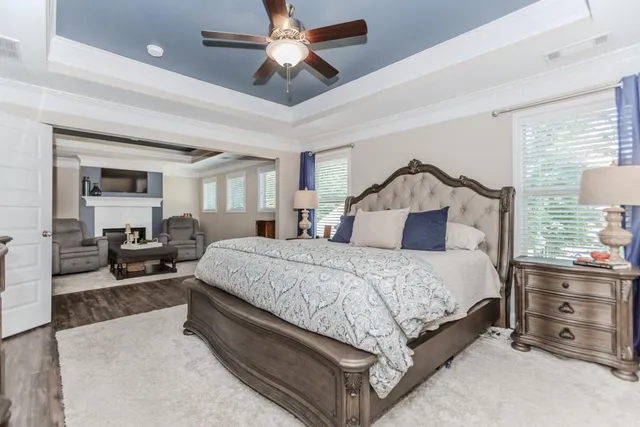a view of a room with wooden floor and white walls