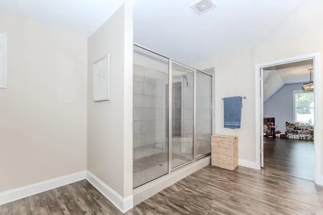 a bathroom with a sink toilet and a mirror
