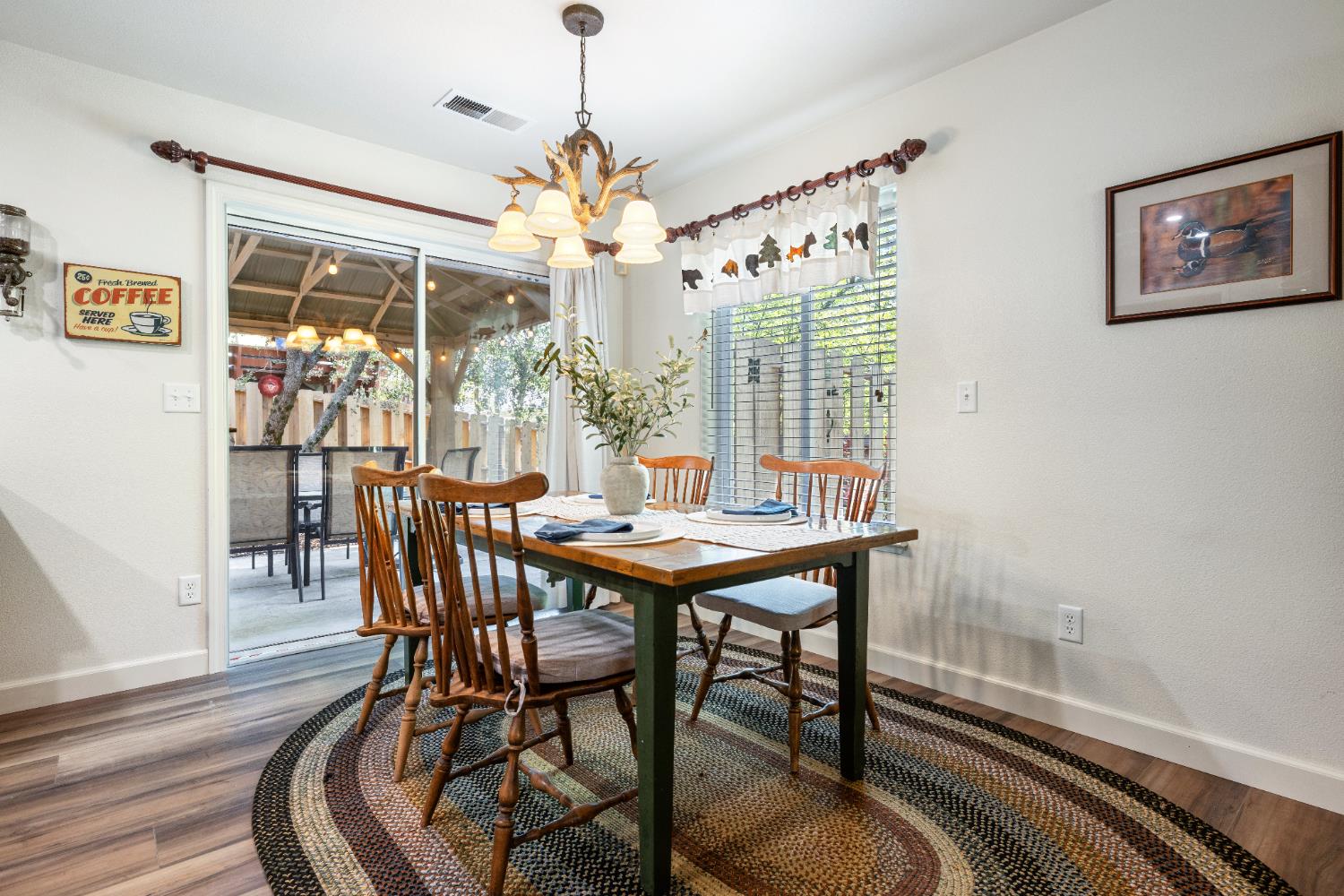 39398 Robin Bass Lake, CA 93604 - Photo 10 of 31 a view of a dining room with furniture wooden floor and chandelier