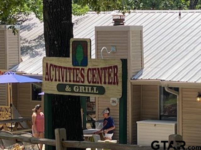 Tbd Lamplight Path Holly Lake Ranch, TX 75765 - Photo 11 of 15 a front view of a house with entryway