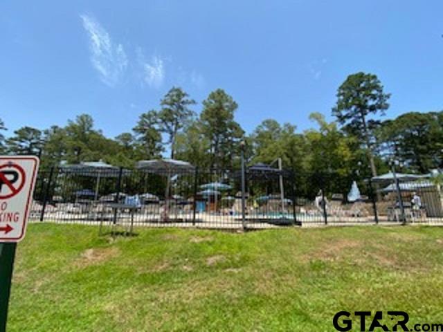 Tbd Lamplight Path Holly Lake Ranch, TX 75765 - Photo 12 of 15 a view of a park with swings and slides