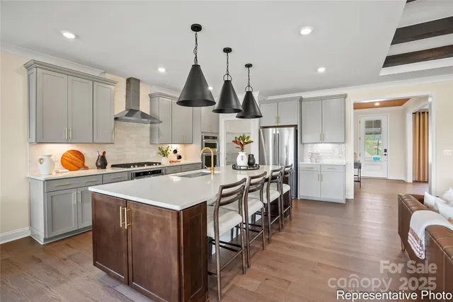 a view of kitchen with cabinets and wooden floor