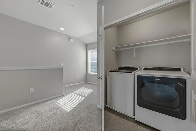 a view of a porch with chairs and backyard