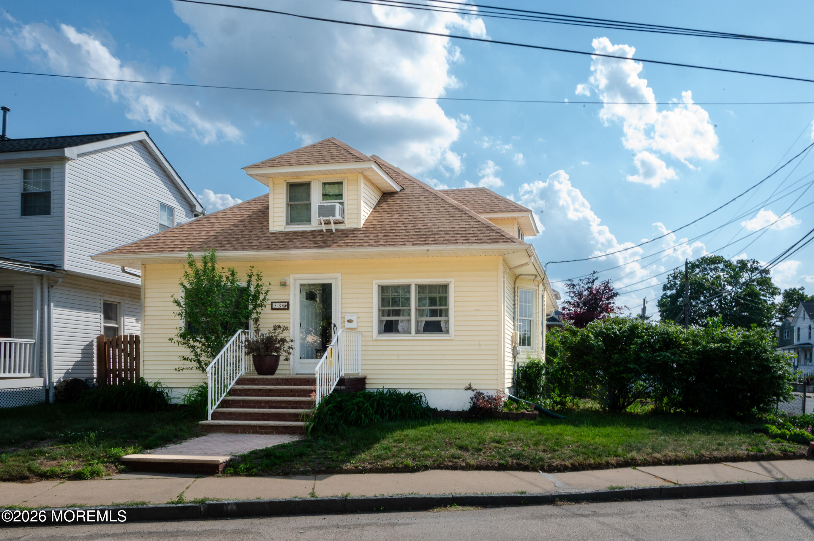 38 Walnut Street Keyport, NJ 07735 - Photo 1 of 19 a front view of a house with a yard