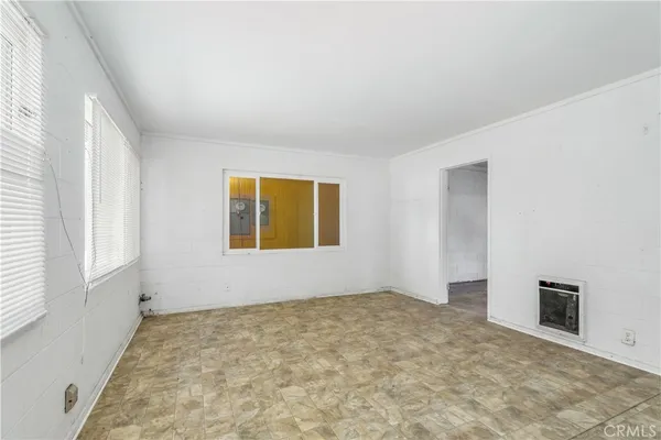 a view of an empty room with a window