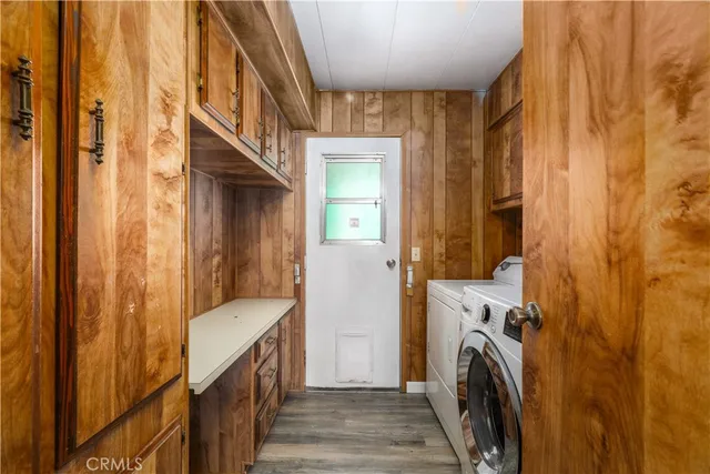 a view of a hallway with washer and dryer
