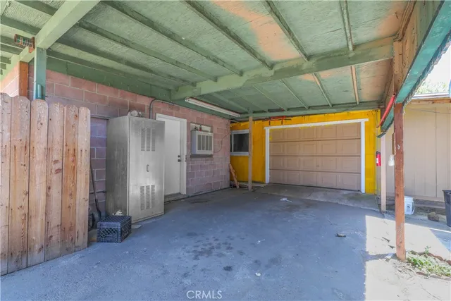 a view of empty room with white walls
