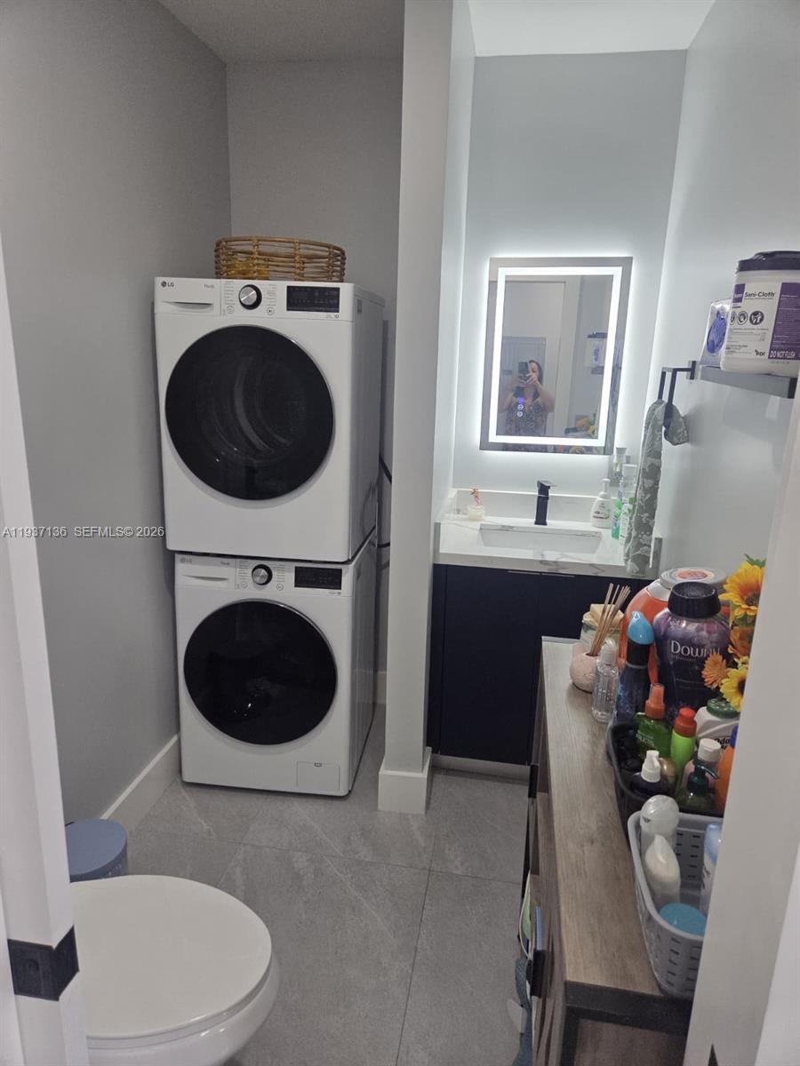 2979 Northwest 88th Street, Unit 1 Miami, FL 33147 - Photo 6 of 7 a living room with a couch and a toilet