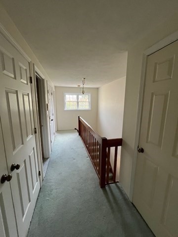 920 Ridgefield Circle, Unit C Clinton, MA 01510 - Photo 13 of 26 a view of a hallway with staircase