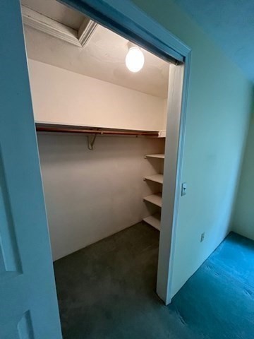 920 Ridgefield Circle, Unit C Clinton, MA 01510 - Photo 21 of 26 an empty room with wooden floor