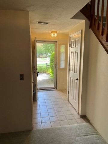 920 Ridgefield Circle, Unit C Clinton, MA 01510 - Photo 4 of 26 a view of a hallway with wooden floor and a livingroom