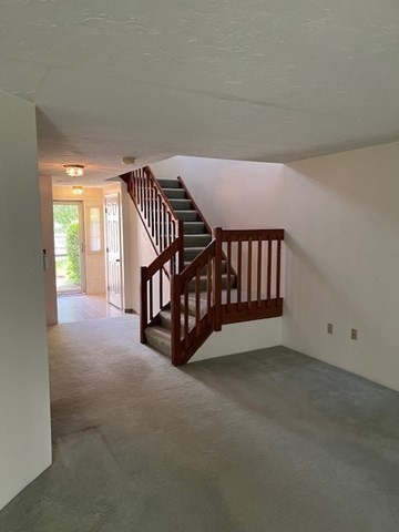 920 Ridgefield Circle, Unit C Clinton, MA 01510 - Photo 5 of 26 a view of livingroom with furniture and staircase