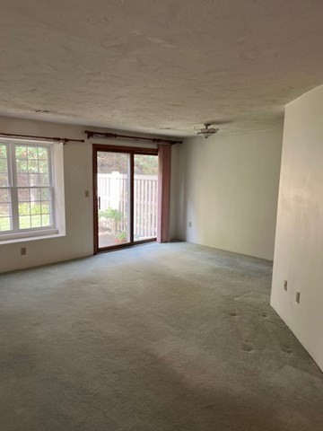 920 Ridgefield Circle, Unit C Clinton, MA 01510 - Photo 8 of 26 an empty room with windows