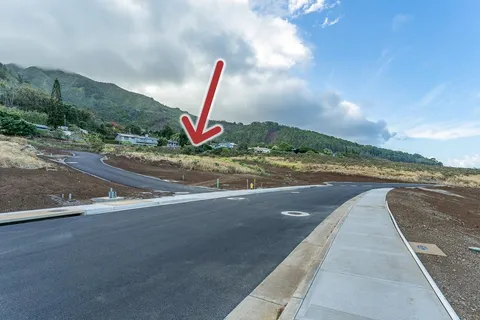 a view of a road with an ocean view