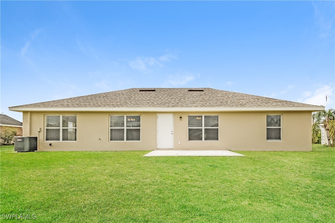 404 Willowbrook Drive Lehigh Acres, FL 33972 - Photo 16 of 16 front view of a house and a yard