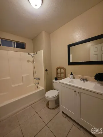 a bathroom with a toilet a sink and bathtub