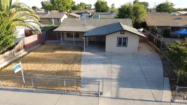 a aerial view of a house with a swimming pool