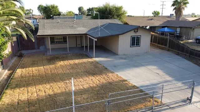 a view of house and outdoor space with swimming pool