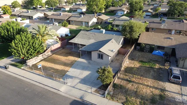 an aerial view of a house with a yard patio swimming pool and outdoor seating