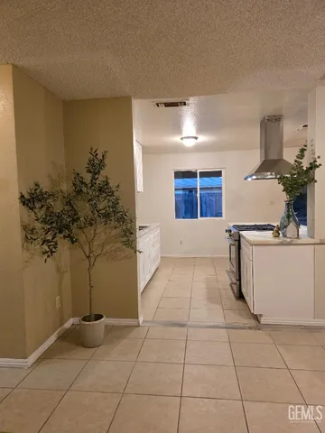 a entryway with a lot of white cabinets