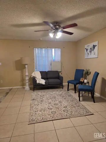 a living room with furniture and a rug