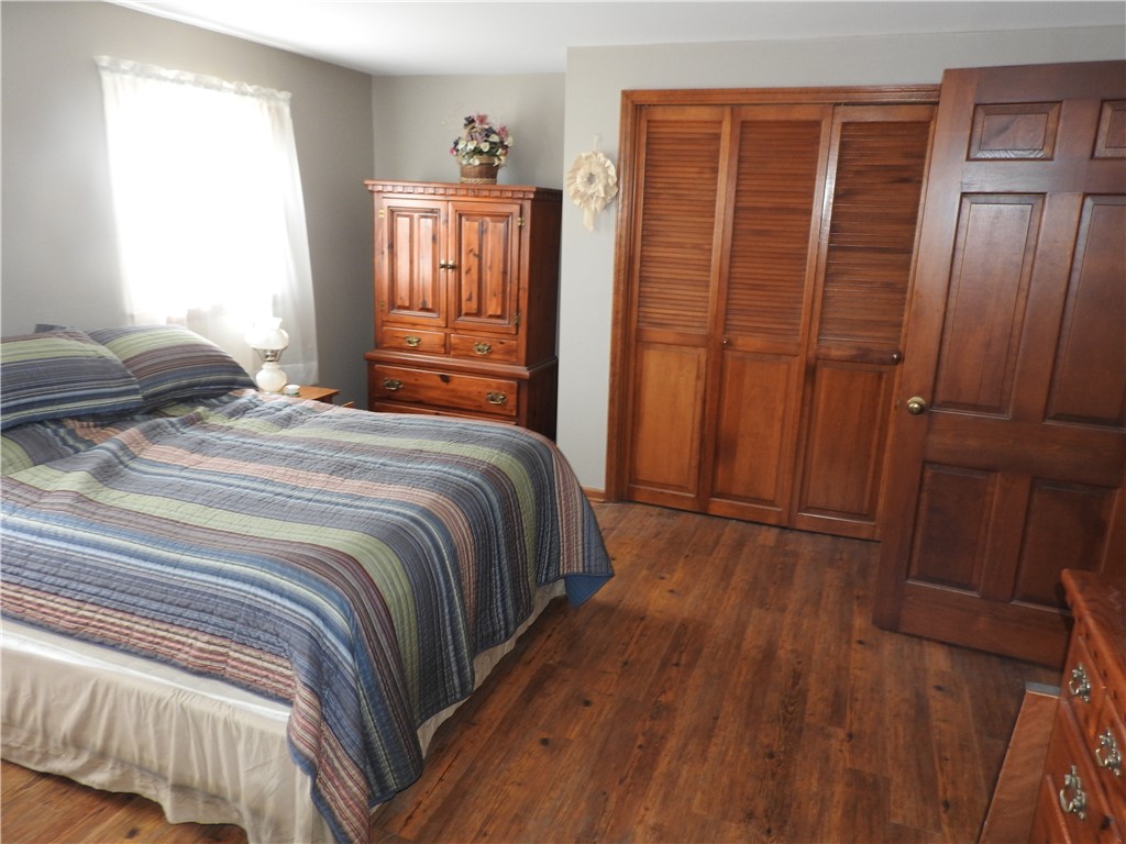 2185 East Loy Road Piqua, OH 45356 - Photo 14 of 19 Warm wood tones and durable flooring create a cozy and inviting private retreat.