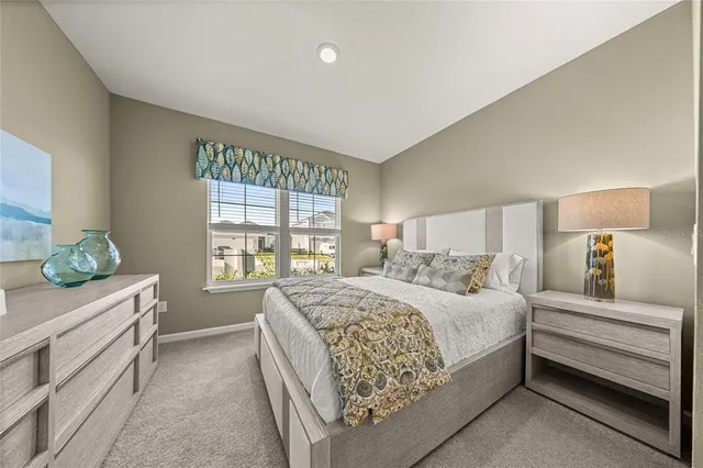 a bedroom with a bed and a dresser