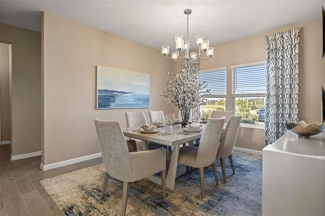 a view of a dining room with furniture window and chandelier