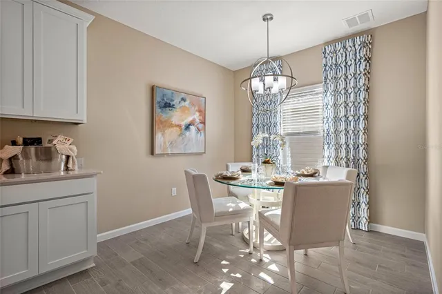 a view of a dining room with furniture window and outside view